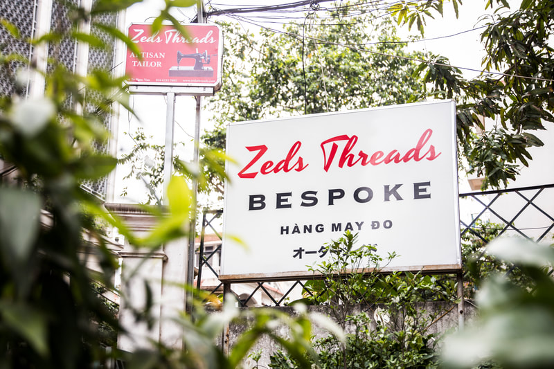 Zeds Threads tailor store. Outdoor sign.